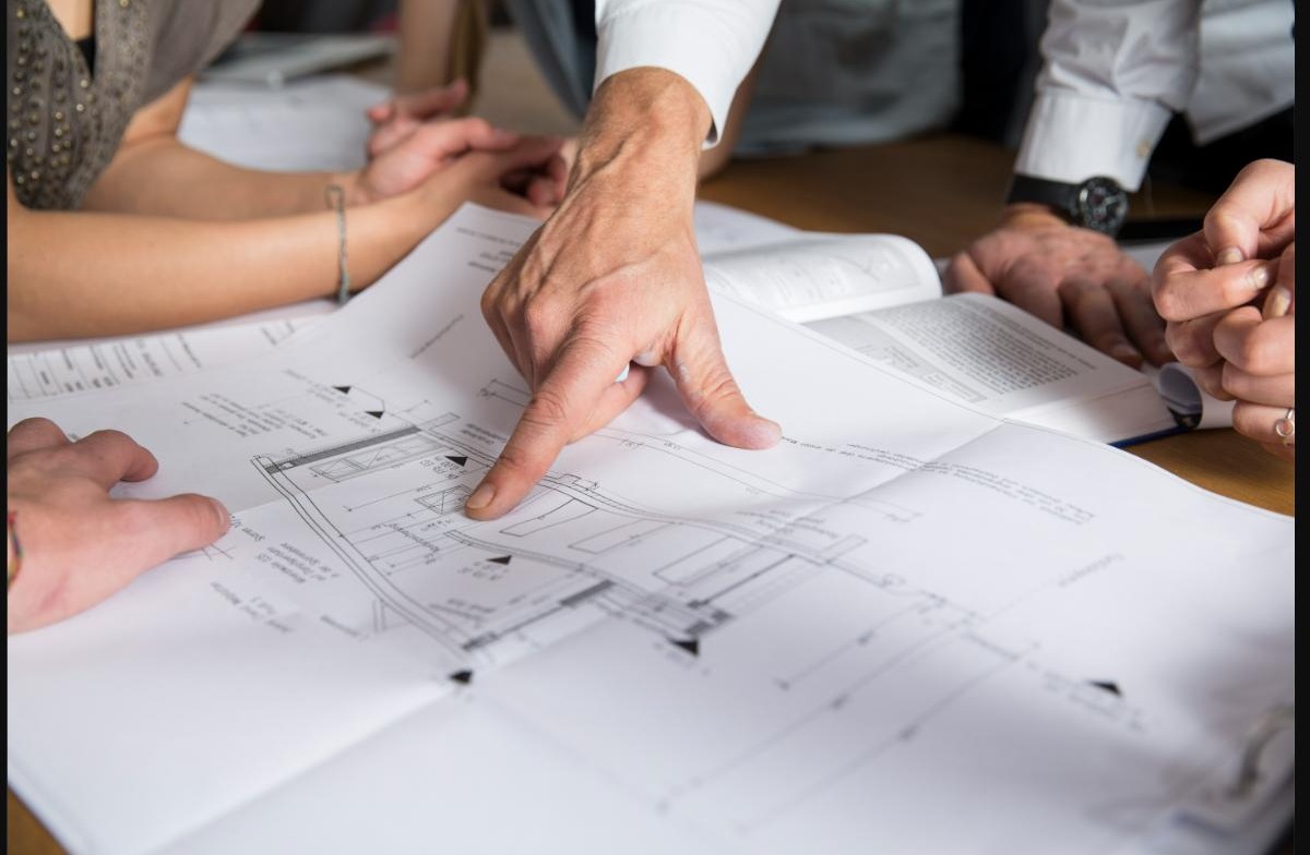 Reviewing detailed construction plans